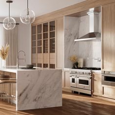 a modern kitchen with marble counter tops and wooden cabinets, along with stainless steel appliances