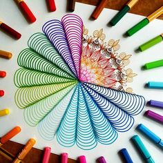 colored crayons are arranged in a circular pattern