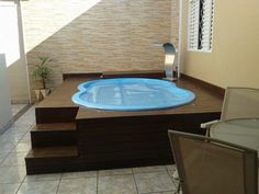 a hot tub sitting on top of a wooden table