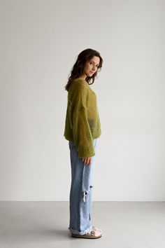 Our olive mohair pullover for women is designed for a gentle and comfortable feel against the skin. Its lightweight texture makes it a joy to wear, while the loose cuffs elegantly accentuate the wrists. Handcrafted with care, this model is offered in one size, enhancing your look with an air of lightness and sophistication. Pair this sweater effortlessly with linen or viscose pants for a refined ensemble. The jumper is available in one size: length - 65 cm, width - 60 cm. Fuzzy Top, Delicate Feminine, Green Hand, Loose Knit, Light Sweater, Boy's Clothing, Sweater Outfits, Pullover Sweaters, Hand Knitting