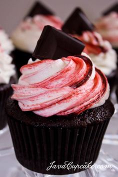 chocolate cupcakes with red and white frosting