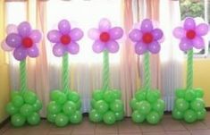 balloon flowers and balloons in front of a window