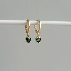 Dainty Emerald Green Heart Charm Huggie Hoop Earrings, 14k Gold Plated Earrings, Vintage Style Earrings, Victorian Earrings  Product specifications: * Material: 14K Gold Plated Brass * Size Each charm measures 0.7cm cm x 0.5 cm Earring Options: * 8mm inner diameter leverback hoops (1.1cm outer diameter, 1.5cm drop) * 10mm inner diameter leverback hoops (1.3cm outer diameter, 1.6cm drop) Packaging and Gifts: * All pieces of jewellery are sent in a mesh jewellery pouch with a thank you card.  Ship Green Dainty Huggie Jewelry, Dainty Green Huggie Hoop Earrings, Elegant Green Dangle Huggie Earrings, Elegant Emerald Huggie Hoop Earrings, Green Emerald Huggie Earrings, Victorian Earrings, Vintage Style Earrings, Green Heart, Huggie Hoop Earrings