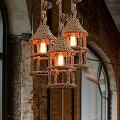 a chandelier made out of rope and lights