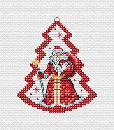 a cross stitch christmas card with santa holding a gift bag and pointing at something in the air