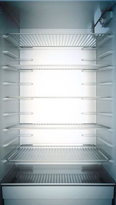 an empty refrigerator is shown with the door open