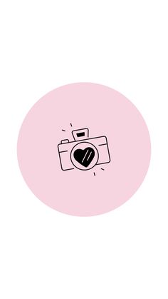 a pink circle with a black heart on the front and an image of a camera in the middle