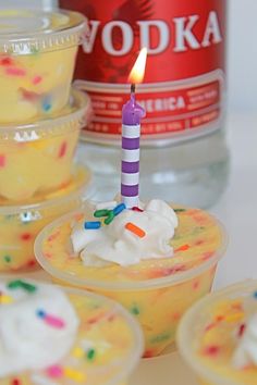 birthday cake pudding shots with a candle on top