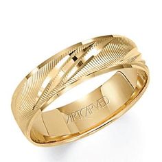 a yellow gold wedding ring with an intricate design