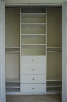 an empty white closet with shelves and drawers