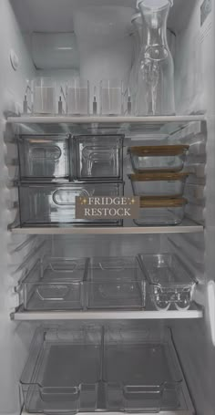 an open refrigerator with the door and shelves full of food in clear plastic bins