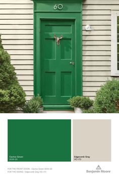 a green door with white trim on the side of a house