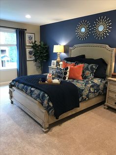 a bedroom with blue walls and white carpeted flooring is pictured in this image