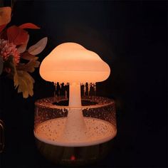 a mushroom shaped light sitting on top of a table