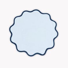 a blue and white circular mirror on a white background with space for text or image