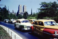 old cars are lined up on the street