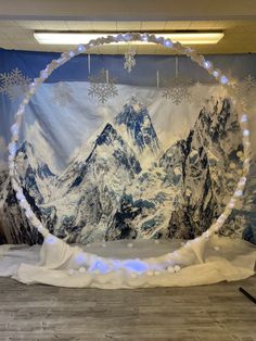 a snow covered wall hanging in the middle of a room