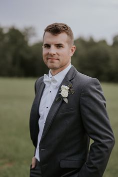 a man in a suit and bow tie