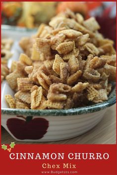 cinnamon churro chex mix in a bowl on a wooden table with an apple