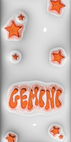 an image of some orange stars and the word genomic on it's side