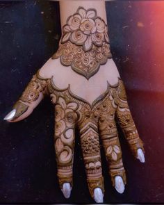 a henna is shown on the palm of someone's hand