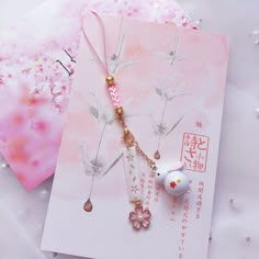 Omamori Lucky Sakura Keychain — The Kawaii Shoppu Sakura Keychain, Спонж Beauty Blender, Cat Bell, Kawaii Phone, Lanyard Keychain, Phone Strap, Cute Keychain, Maneki Neko, Couple Gift