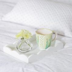 Designed to sit beautifully on any bedside table, coffee table, or sideboard this glossy, white lacquer tray boasts a playful scalloped edge and deep straight sides. A must-have for any home this piece functions wonderfully as a vanity tray, drinks tray, or for displaying small trinkets.DESIGN DETAILS- Cream velvet base with embossed logo- Finished with 20 coats of high gloss lacquer- Hand polished between each coat of lacquerDIMENSIONS: 11 in. x 8 in.CARE- Arrives beautifully packaged and ready Relaxing Spaces, Addison Ross, Candles Luxury, Spring Interiors, Dinner Tray, Colour Trend, Elegant Dinner Party, Drinks Tray, Small Trinkets