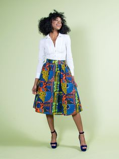 "Elegant African Print ankara midi skirts. Pair this gorgeous blue african print modern skirt with a tank or crop for a casual look; or with an elegant blouse for a more formal look. Load up on the accessories! Great as african formal wear, african ankara work or church skirts! Length: approx. 27\" 2 concealed pockets Elastic back allows for stretch Model wears Small Ships from the USA within 1 to 2 business days" African Formal Wear, African Midi Skirt, Ankara Midi Skirt, African Print Midi Skirt, Blue African Print, Dashiki Skirt, Church Skirts, Midi Skater Skirt, Modern Skirt