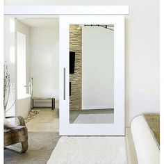 a bedroom with white walls and carpeted flooring