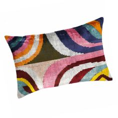 a multicolored decorative pillow on a white background