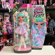 a couple of dolls are on display in a toy store, one is pink and the other is blue