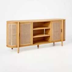 the sideboard is made out of wood and has wicker panels on one side