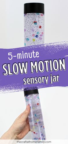 someone holding up a glass tube with the words 5 minute slow motion sensor jar on it