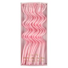 pink plastic straws in a box on a white background