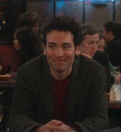 a man sitting at a table in a restaurant