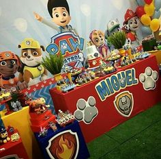 an image of a birthday party with balloons and stuffed animals on the wall behind it