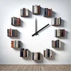 a clock made out of books on the wall