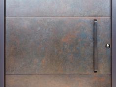 a close up of a metal door with a handle on the front and side panels