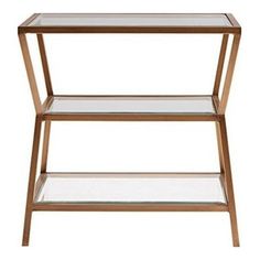 the side table with glass shelves is shown in gold and has two shelves on each side