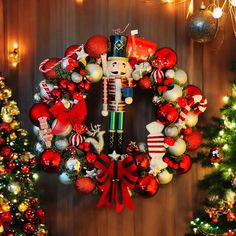 a nutcracker wreath is hanging on the wall next to christmas trees and other decorations