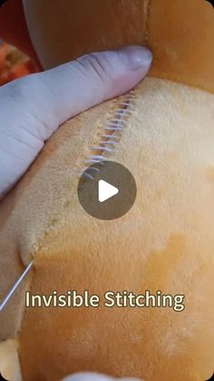 someone is stitching the inside of a stuffed animal