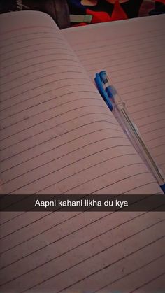 an open notebook with a blue pen on it and the words apni kahani likka du kya