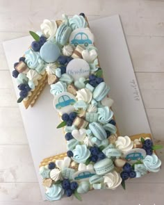 the number one cake is decorated with blue and white icing