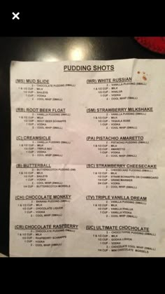 a menu for pudding shots on a table