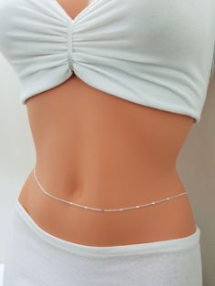 Simple Belly Chain, Belly Chain, Gold Belly Chain Simple and elegant! The newest trend in body jewelry, belly chains are super cute and easy to wear. Perfect on the beach or outfits. Comes elegantly in a gift box or cute organza bag, ready to give. ★Details: ~ The belly chain is made up of delicate silver plated chain with small sparkling discs. ~ The belly chain is secured at the back with a clasp and provided with a 2 inches adjustment extension for flexibility. ~ Comes elegantly in a cute pac Cheap Party Waist Chain, Cheap Adjustable Metal Waist Chain, Adjustable Silver Waist Chain As Gift, Adjustable Silver Waist Chain For Gift, Delicate Silver Body Chain For Party, Dainty Silver Adjustable Waist Chain, White Body Chain For Gift, Dainty Adjustable Silver Waist Chain, Adjustable Silver Dainty Waist Chain