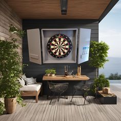 a dart board mounted to the side of a wall next to a table with chairs