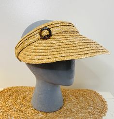 "An absolutely perfect vintage straw sun visor, beach hat, straw with a little celluloid circle clip. Cool festival hat, iconic 60s style.  Brim measures 14\" in diameter, stretches to fit about any head. Good clean condition, BUT A LITTLE YELLOWING ON INSIDE OF BAND." Adjustable Retro Summer Hat, Retro Adjustable Wide Brim Sun Hat, Retro Wide Brim Adjustable Sun Hat, Vintage Visor Hats For Summer, Adjustable Gold Boater Hat For Summer, Vintage Summer Visor Hat, Retro Vacation Hat, Retro Brimmed Sun Hat For Summer, Retro Adjustable Sun Hat For Vacation