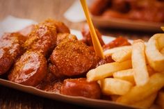 hot dogs and french fries on a plate