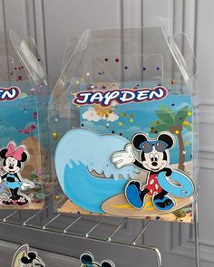 two plastic trays with mickey and minnie mouse pictures on them