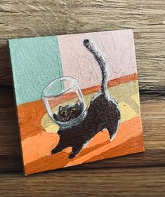 a painting of a black cat with a wine glass in it's mouth on a wooden surface